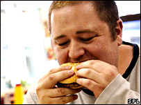 obese man eating