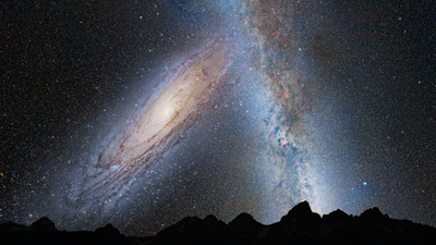 An illustration shows the night sky 3.75 billion years from now. Andromeda (left) fills the field of view and begins to distort the plane of our Milky Way Galaxy