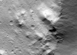 One of the first images obtained by Dawn in its low altitude mapping orbit, shows an area within the Rheasilvia basin in the south polar area of Vesta