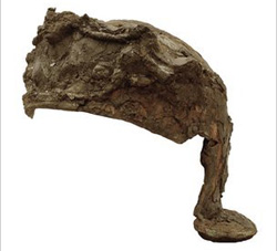 The helmet had to be rebuilt from hundreds of corroded pieces stuck in a block of earth