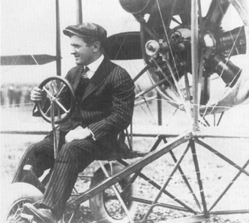 Lincoln Beachey in his plane wearing a business suit