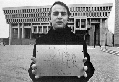 Sagan holding Pioneer plaque