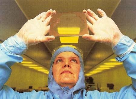 a worker checks a chip mask