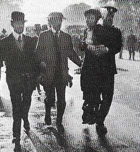 Emmeline Pankhurst, leader of the suffragettes, is carried away by the police during a demonstration.