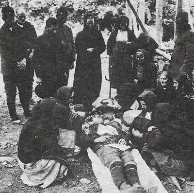 The first Bulgarian soldier to be killed in the first Balkan War is surrounded by mourners.