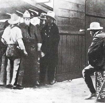 Hollywood began, according to screen legend, in a barn in which Cecil B. DeMille (seated on a humble box) directed The Squaw Man in 1913.