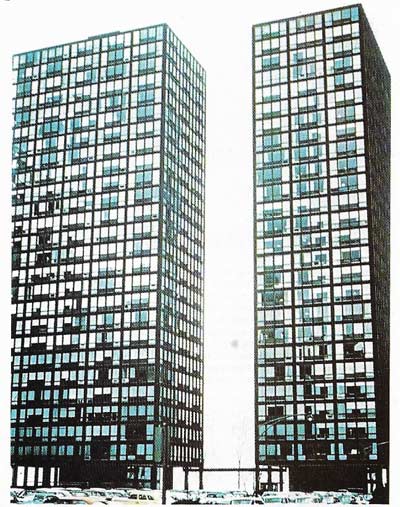 Two identical towers, at right angles to each other, make up the Lake Shore Apartments, Chicago, by Miles van der Rohe.