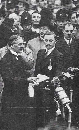 The Munich Agreement of 29 September 1938 typified Britain's policy of appeasement. Britain, France and Italy agreed that the Sudeten region of Czechoslovakia should be ceded to Germany. British Prime Minister Neville Chamberlain (1869-1940), shown here on his return from Munich, made an agreement with Hitler to consult on any future Anglo-German questions.