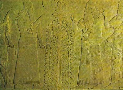 Two figures, one of 6 them (to judge from clothing and inscription) perhaps representing the ninth-century king Ashurnasirpal II of Assyria, stand on either side of a 'tree of life'.