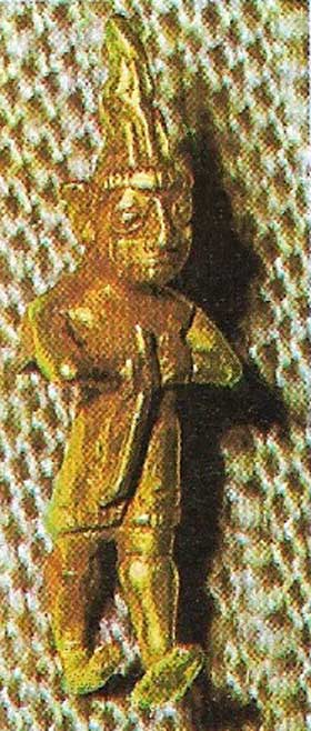 Gold statuette (4.2 cm (1.7 in) high) of a man, perhaps a king, wearing a full tunic with short sleeves.