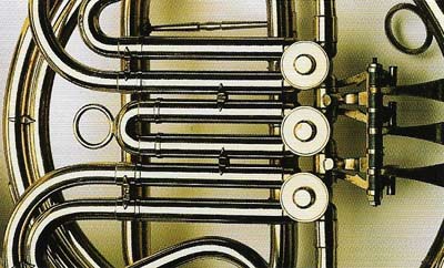 Close-up view of the rotary valves on a French horn.