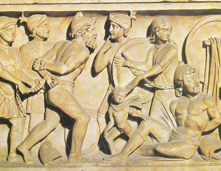 This detail from a sarcophagus shows Roman soldiers subduing barbarians.