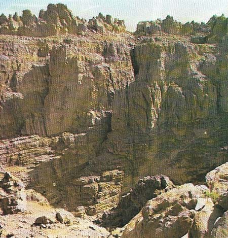 Tassili N'Ajjer, an 800 km-long (1500 miles), eroded sandstone plateau in the Sahara, contains tens of thousands of rock paintings and engravings.