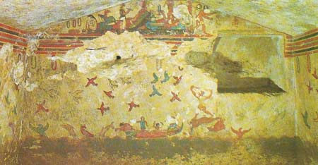 The Tarquinian tomb type was a rectangular chamber cut in the rock and approached by a sloping ramp. The chambers were then plastered and painted with vivid scenes of the highest beauty and significance. On the end wall of the Tomb of Hunting and Fishing (c. 520 BC), the funeral feast occupies the gable, with a frieze of mourning wreaths below.