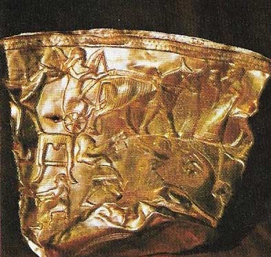 The crushed bowl of Hasanlu, exquisitely made in gold, shows a weather god in a chariot drawn by a bull, and a battle with a monster.
