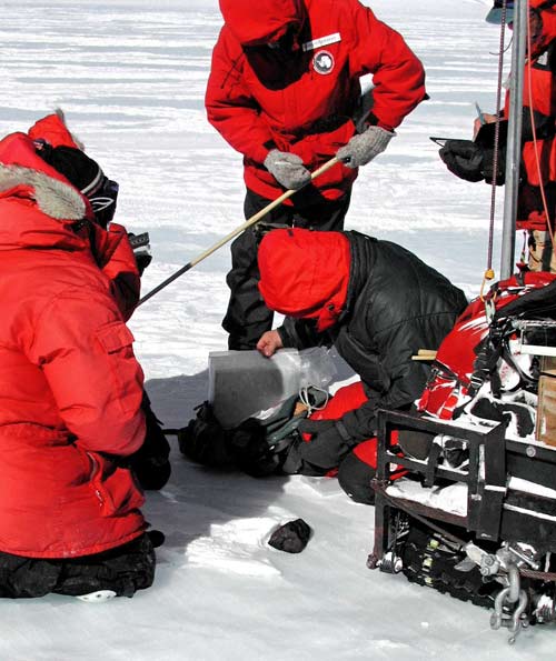 Recovery of a meteorite in Antarctica by members of the US Antarctic Search for Meteorites (ANSMET) expedition.