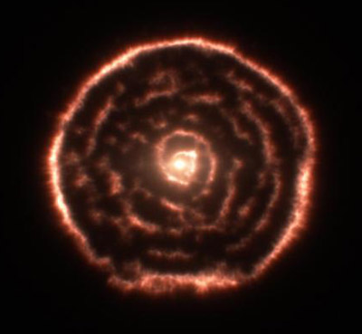 Observations using the Atacama Large Millimeter/submillimeter Array (ALMA) have revealed an spiral structure in the material around R Sculptoris. This feature has never been seen before and is probably caused by a hidden companion star orbiting the star. This slice through the new ALMA data reveals the shell around the star, which shows up as the outer circular ring, as well as a very clear spiral structure in the inner material. Credit: ALMA (ESO/NAOJ/NRAO)