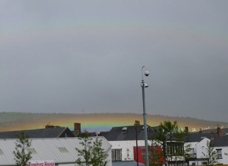 A low-lying rainbow with secondary rainbow over the town of Penrith in Cumbria, England