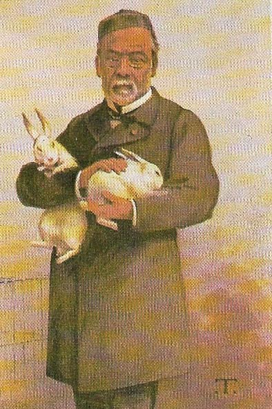 Pasteur holding rabbits