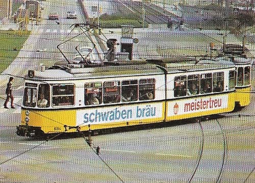 An articulated tram makes its way through the streets of Stuttgart in Germany.