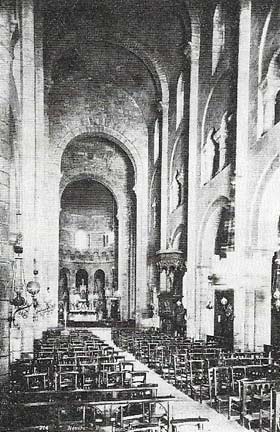 The nave of Etienne, Nevers (c. 1070), looking east toward the high altar, is made narrow and dark by the need to support the stone barrel vaults.