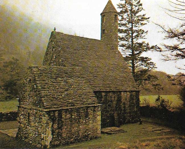 Glendalough in Co Wicklow was a place of beauty and sanctity, sacred to St Kevin. Known as St Kevin's Kitchen (c. ninth century), the building has a vaulted ceiling which supports a corbelled roof in an ingenious manner.